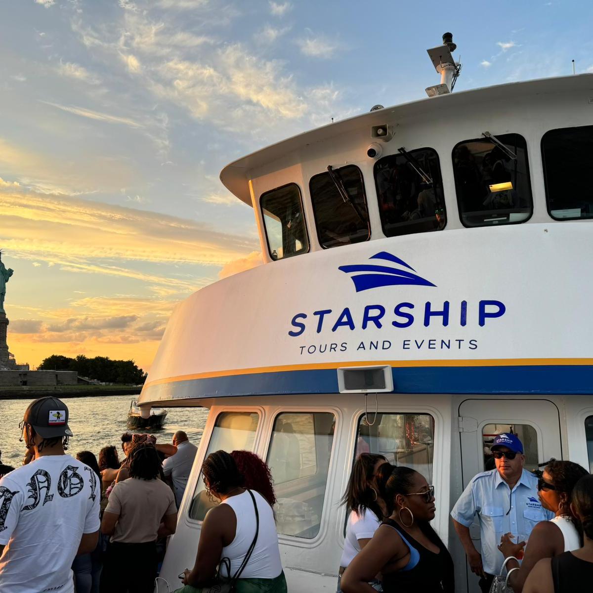 a group of people standing in front of a bus