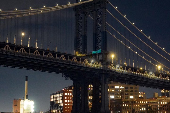 a large bridge lit up at night