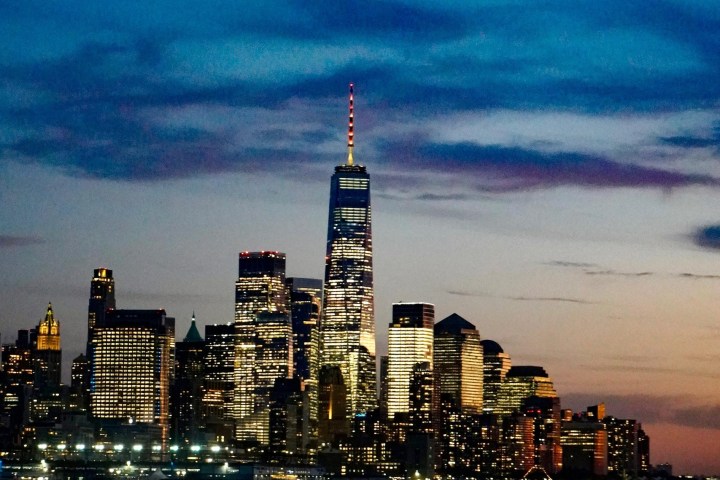 a large body of water with a city in the background